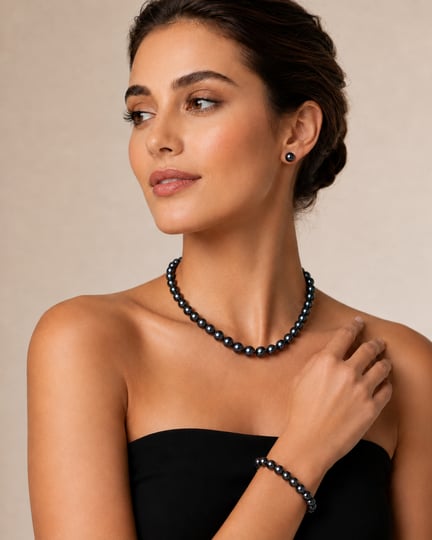 Model wearing a pearl necklace, stud earrings and bracelet