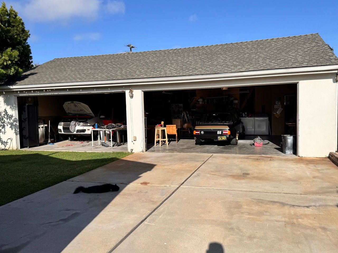 Inside the garage — project cars up on stands