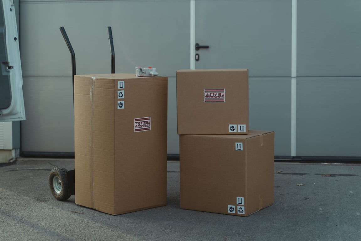 Cardboard boxes on a hand truck ready to ship