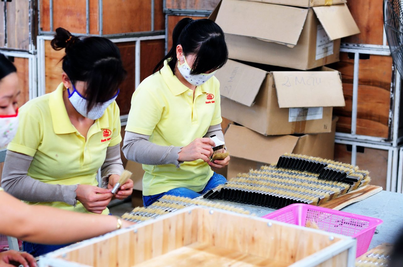Factory workers packing product for a private label order