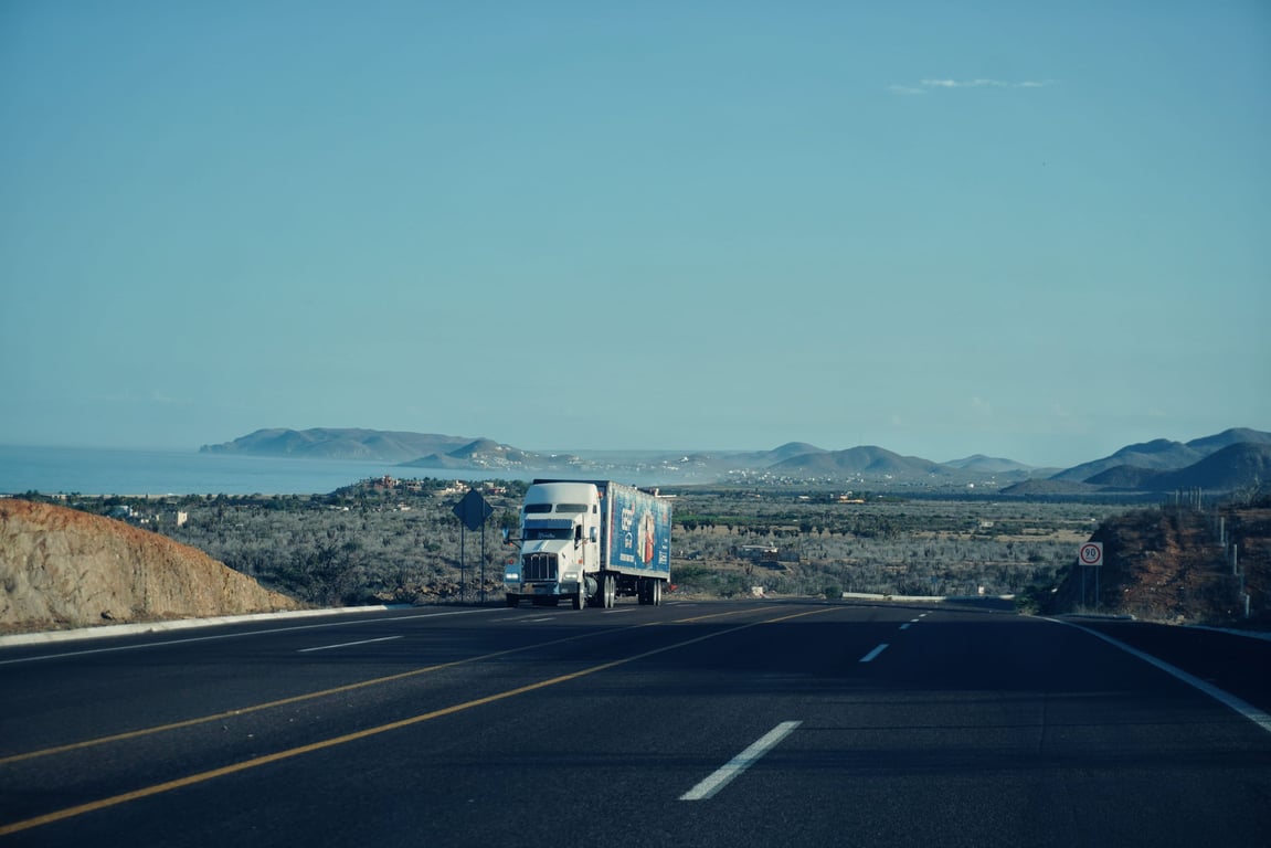 Semi-truck hauling freight on a highway