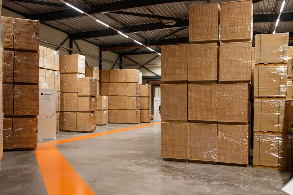 Stacked cases of boxed product in a warehouse