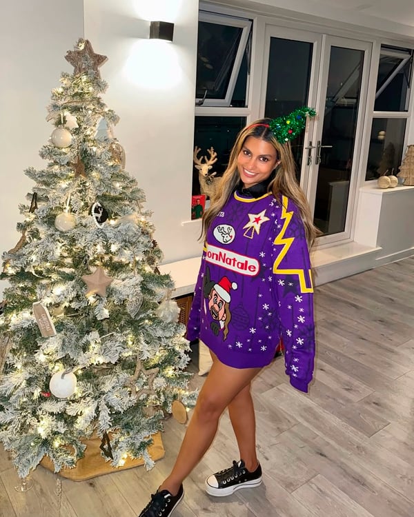Customer wearing a Christmas Jumper