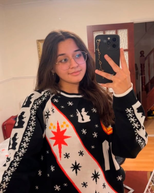 Customer wearing a Christmas Jumper