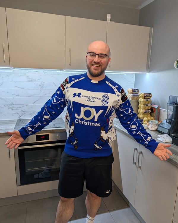 Customer wearing a Christmas Jumper