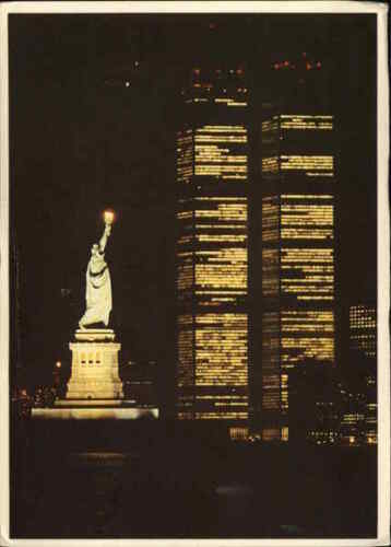Statue of Liberty at night with Twin Towers