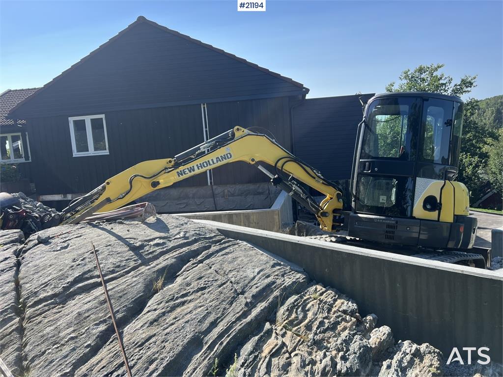 New Holland E55B excavator w/ digging bucket, sanding bucket, 2012 21194 E55B excavator w/ digging bucket, sanding bucket,...