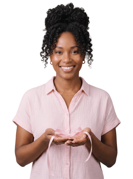 Smiling woman holding a delicate pink awareness ribbon