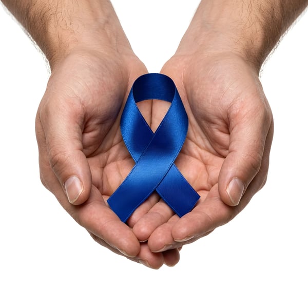 OPEN HANDS HOLDING BLUE AWARENESS RIBBON