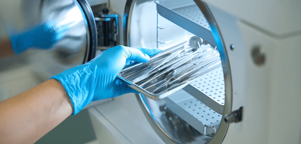 Sterile services technician preparing surgical instruments