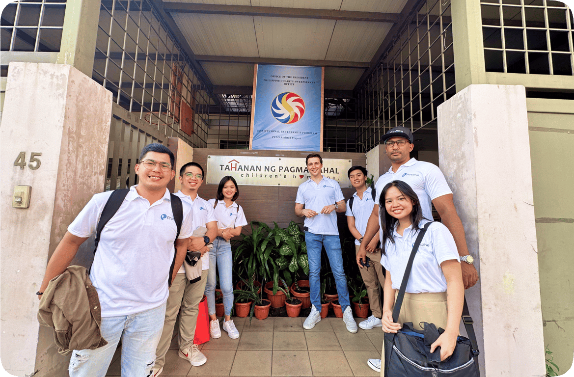 A Prostrive group brainstorming around a table, symbolizing ownership and collaboration