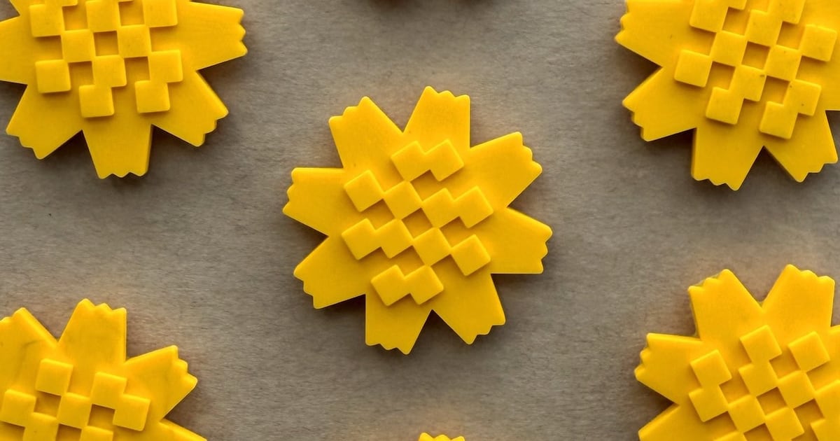 گوڵی عەرفەج وەک نیشانەی پاڵپەستوویی کوەیتی دەردەکەوێت لە ناو شەڕی بەردەوامدا