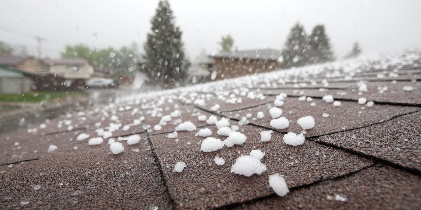 Trinity assessing hail damage on a commercial roof in Colorado