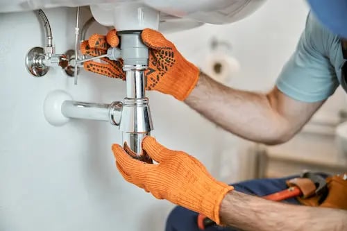 DB Plumbing technician repairing plumbing