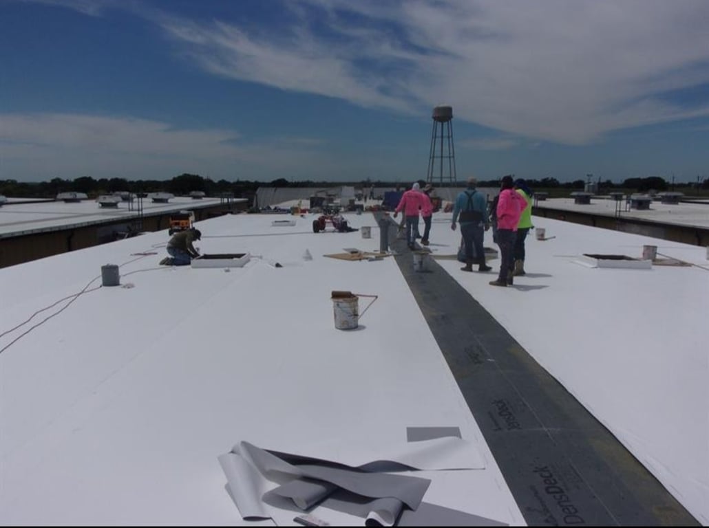 Trinity Construction Services crew on a commercial roofing project in Colorado
