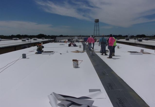 Trinity Construction Services crew on a commercial roofing project in Colorado