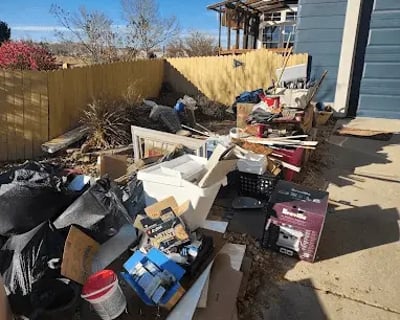 86it! junk removal crew loading a truck in Loveland, CO