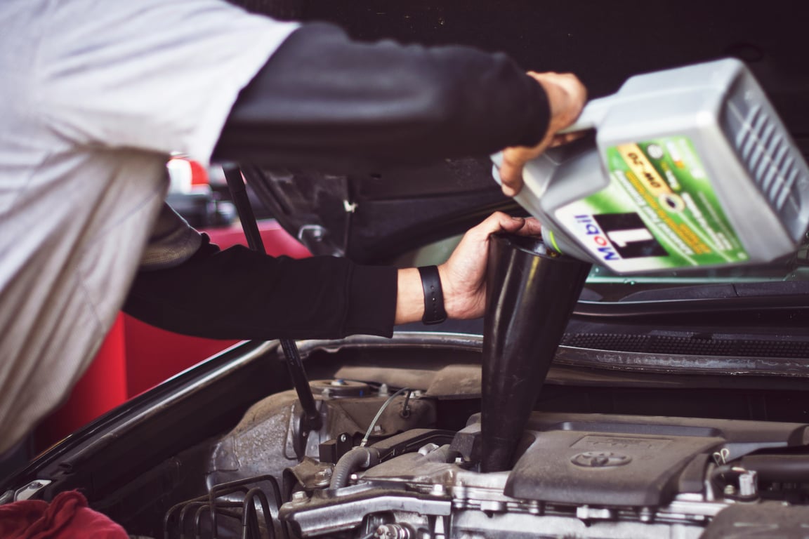 A technician servicing a vehicle at TWRKS