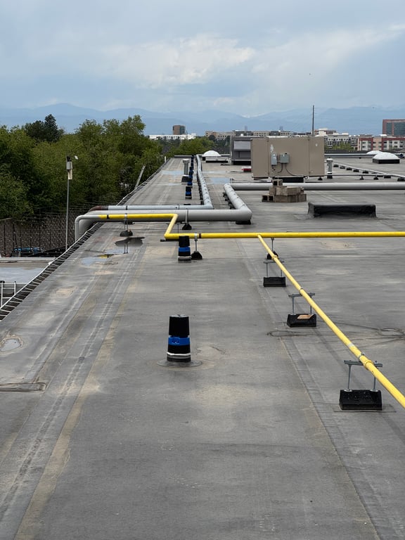Trinity Construction Services crew on a commercial roofing project