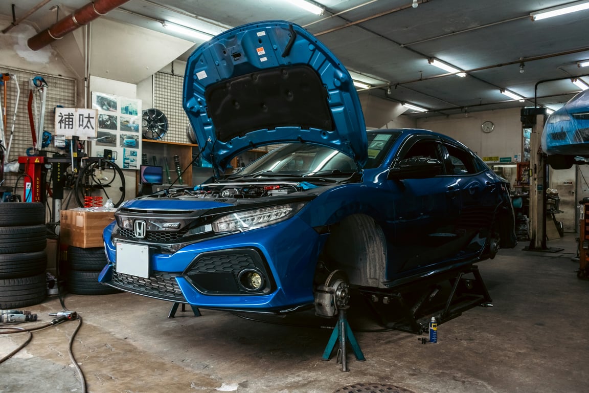 A technician servicing a vehicle at TWRKS