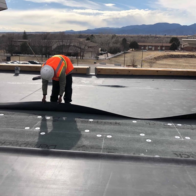 Trinity Construction Services crew on a commercial roofing project