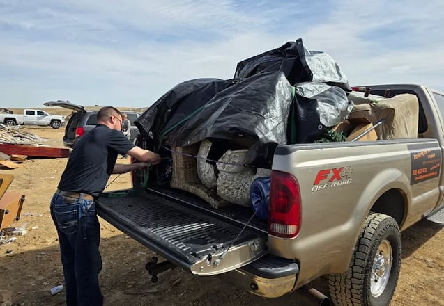 86it! junk removal crew loading a truck in Loveland, CO