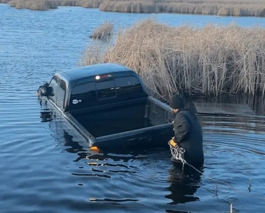 Randy Gordon recovering a pickup from a lake