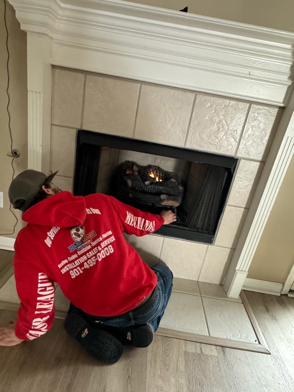 Technician inspecting a residential furnace