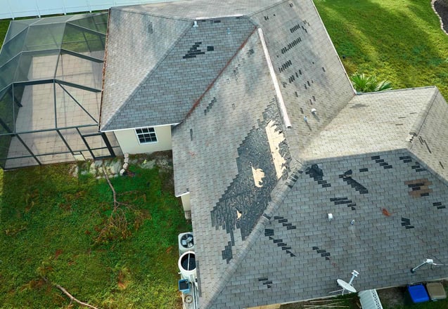Trinity assessing wind damage on a commercial roof in Colorado
