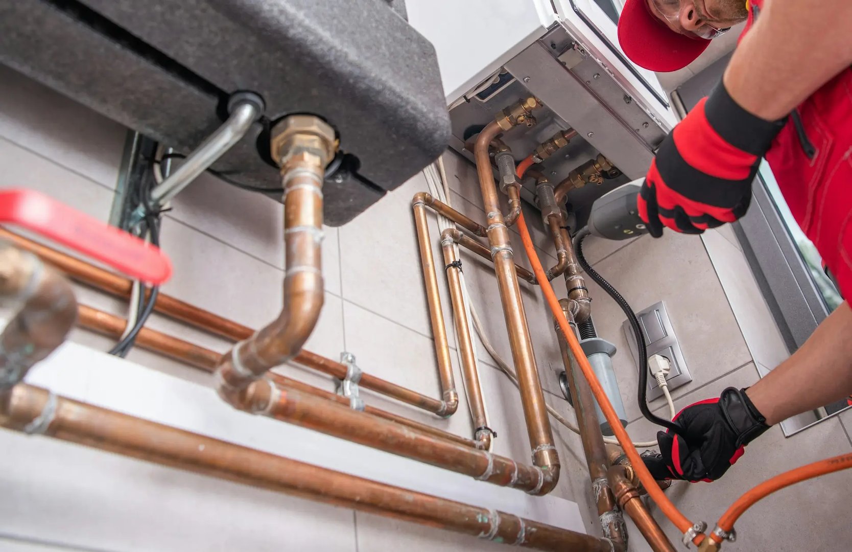 Technician repairing residential plumbing