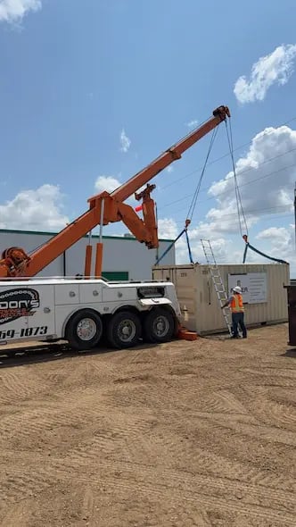 Gordon's Towing moving a storage container