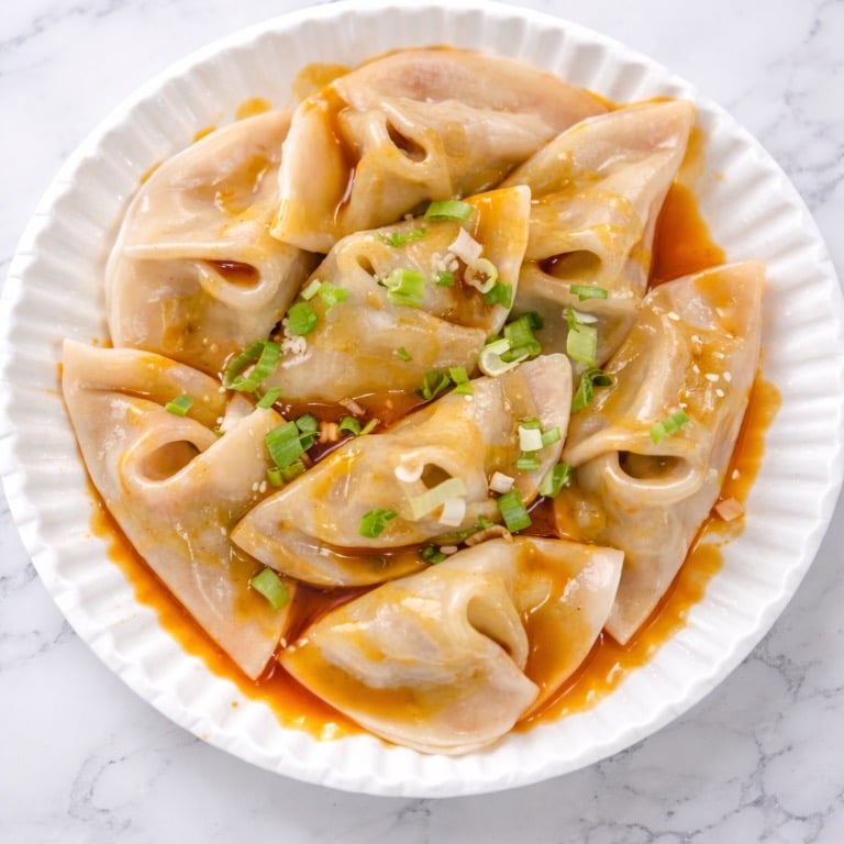 11b.Spicy Chicken Dumplings.w.Peanut )Sauce (8)（红油鸡饺）