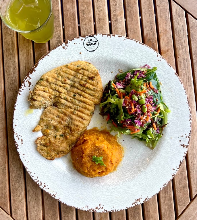 Organic chicken Milanese with potatoes and salad