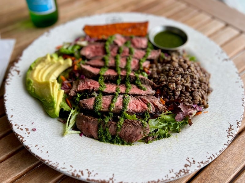 Steak with chimichurri and mixed greens salad