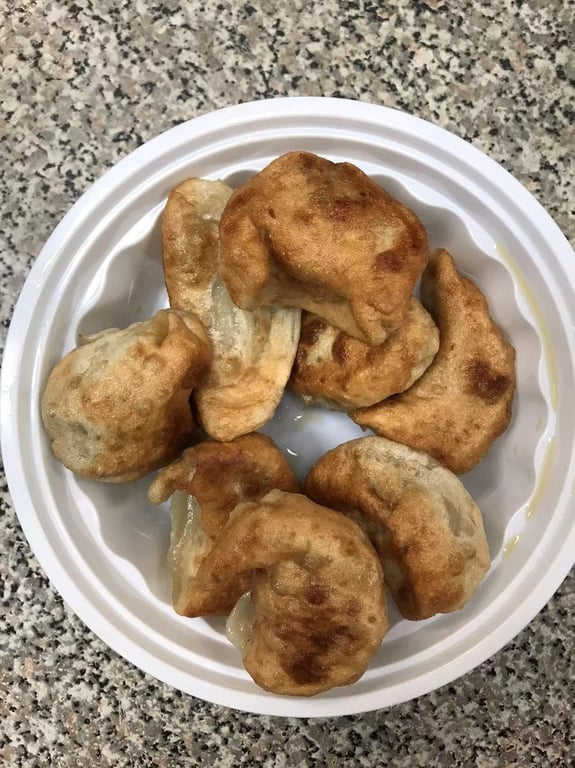 A10a. Fried Dumplings (8) 锅贴