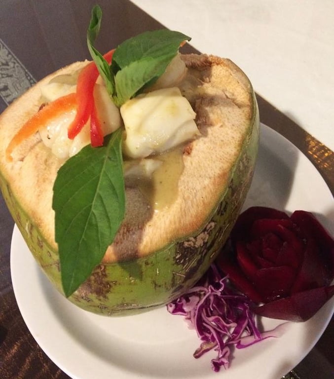 H5. Young coconut seafood in Green Curry Sauce Image