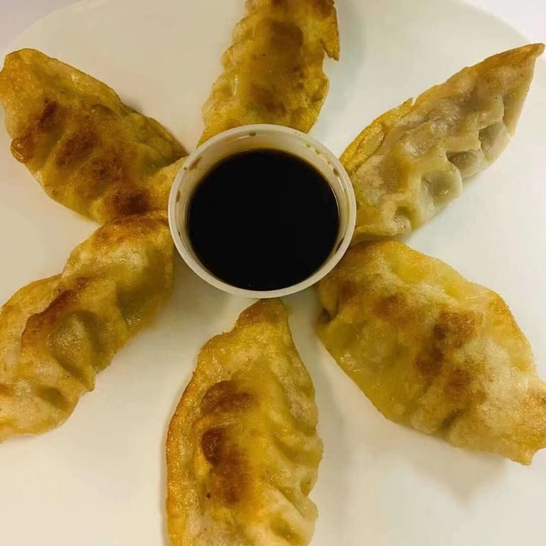 30. Pan Fried Dumplings (6)<br> 锅贴