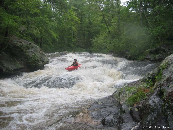 John Mcrae in a fun multi-drop slide above Panther falls.