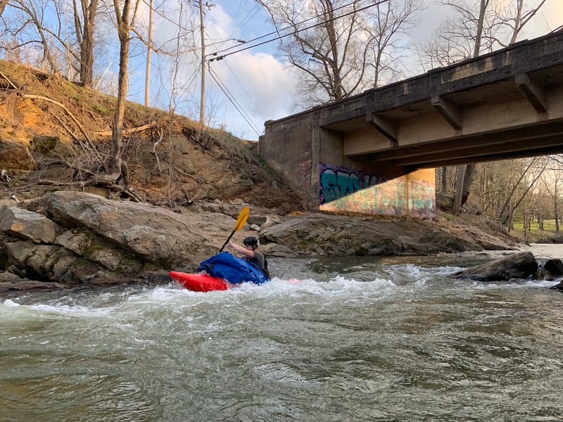 Hauling trash through Bear Creek Rapid