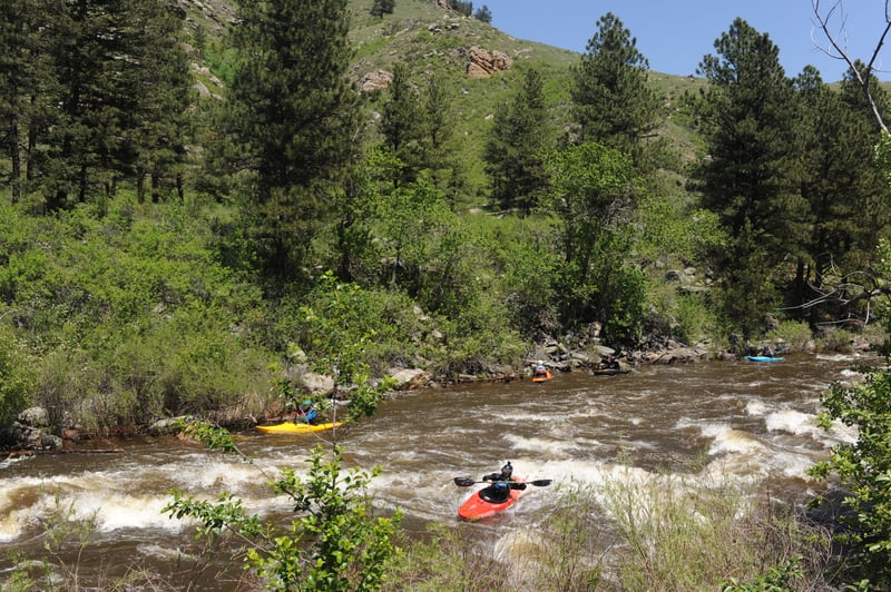 Clinton Surfing the Wave at the Top of Greyrock Bridge Rapid