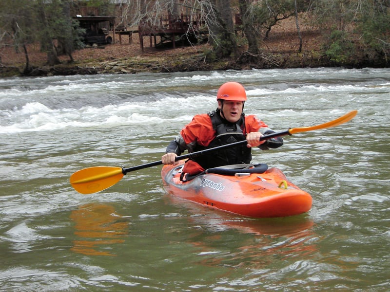 Zippy pulling out of the surfing wave below Canoe Eating Rock