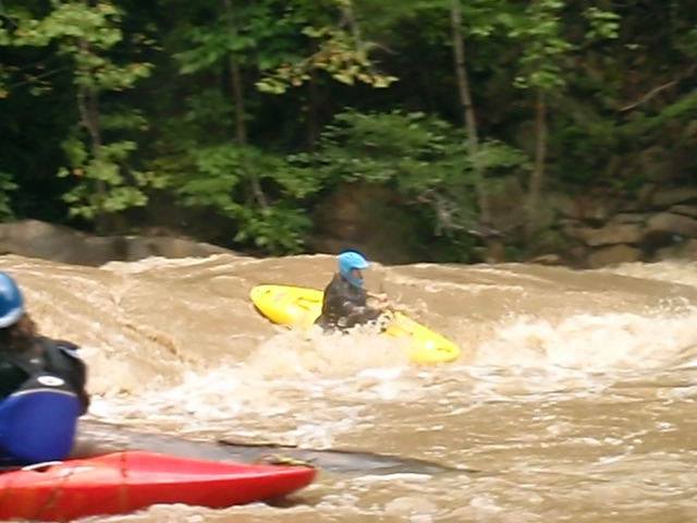 Paddling the last rapid above the falls