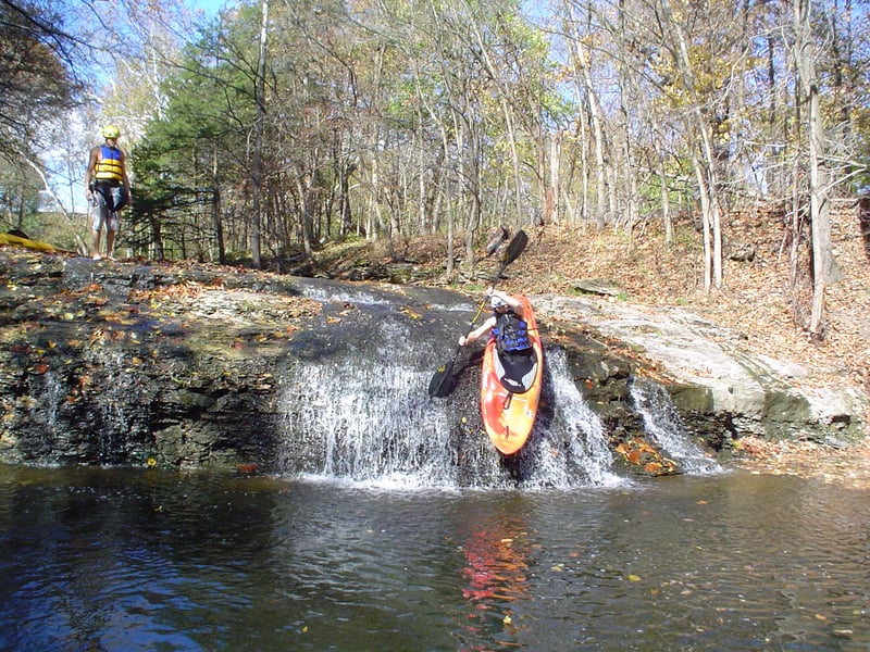 Clint dropping over the edge of the falls, low water