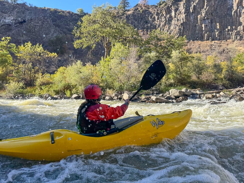 Peeling out of mid-rapid pocket eddy along wall