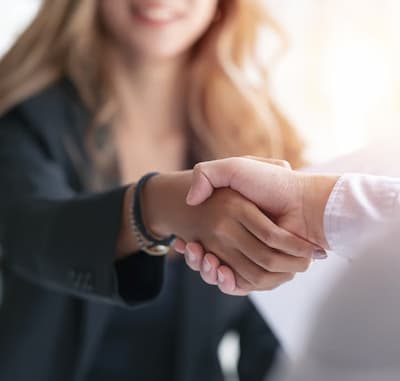 people closing a deal shaking hands