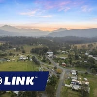 ¼ Acre with 2 Properties Prime Main Street Frontage Business image