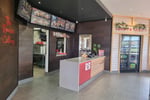 Premium Red Rooster In Gladstone Park