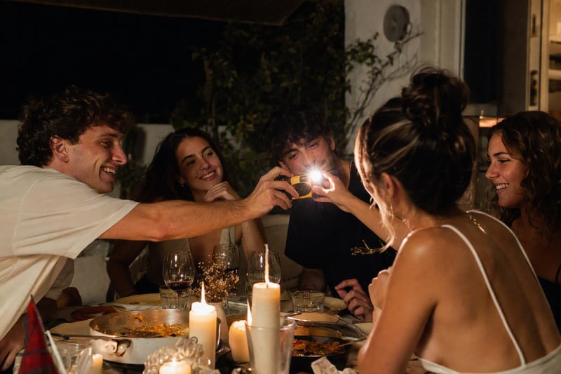Friends at a night-time party photographed with a flash and a shared camera roll