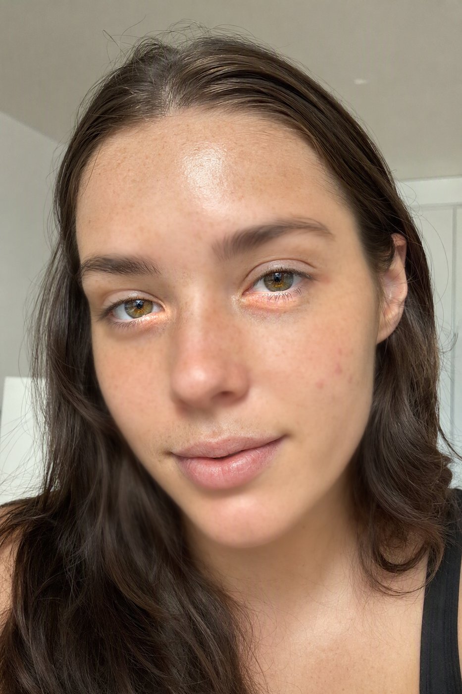 After: The Facetune signature: the same photo with smoothing at 60 percent. Freckles gone, skin like a render