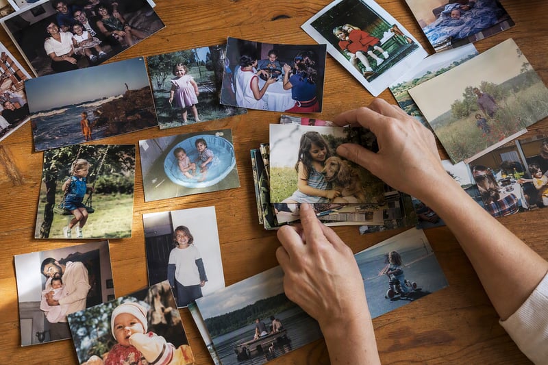 A phone screen showing a grid of holiday photos being narrowed down to a final set